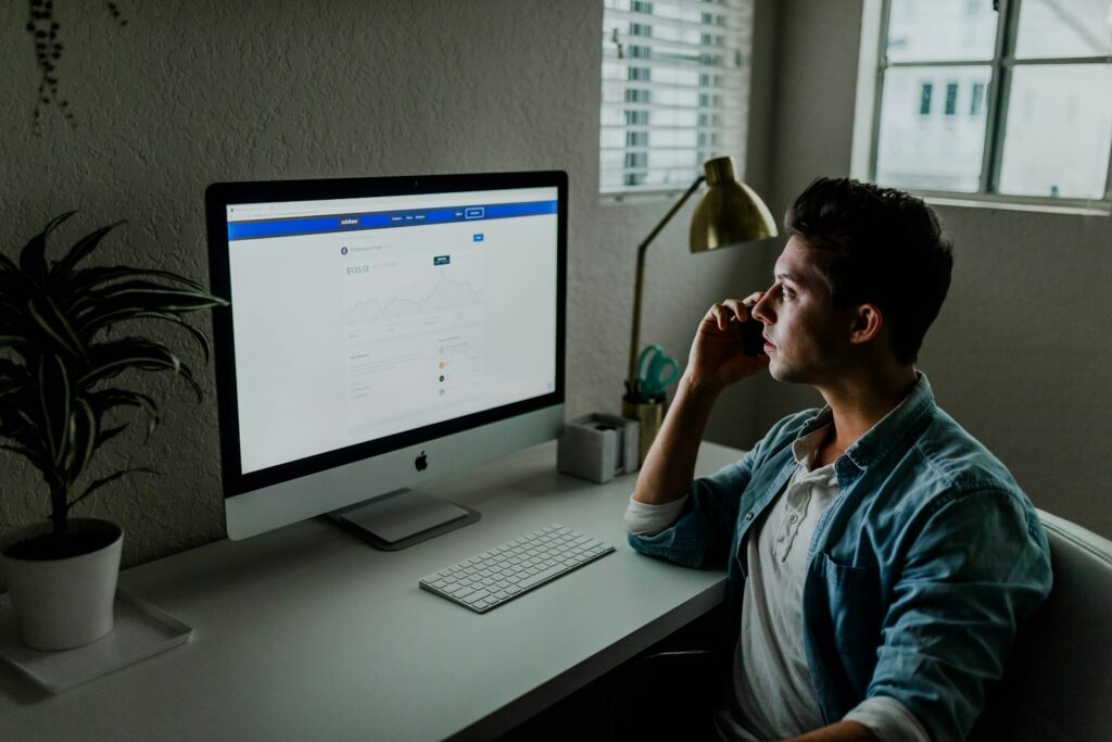 21gwwco jbq - Improve Your Facebook Ads man in blue denim jacket facing turned on monitor