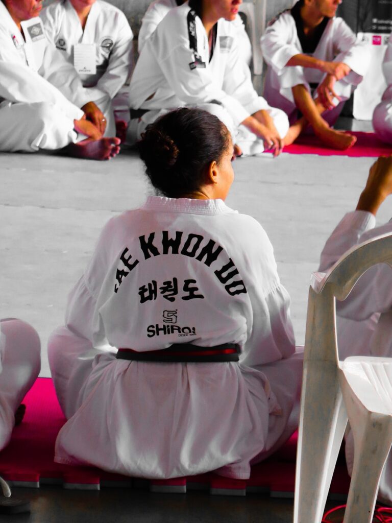 42f0omhwez4 - How to Handle Martial Arts Student Complaints and Turn Them into Opportunities girl wearing karate gi sitting on pink puzzle mat