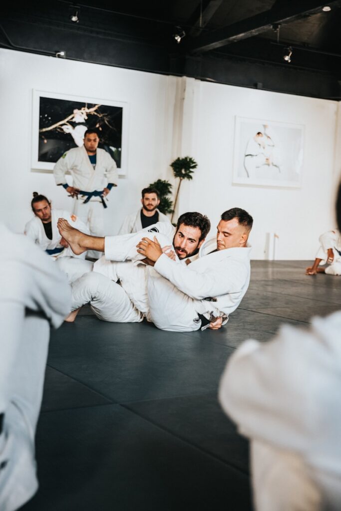4xkzzcragp8 - Using Gamification to Boost Engagement in Martial Arts Classes man in white dress shirt sitting on floor