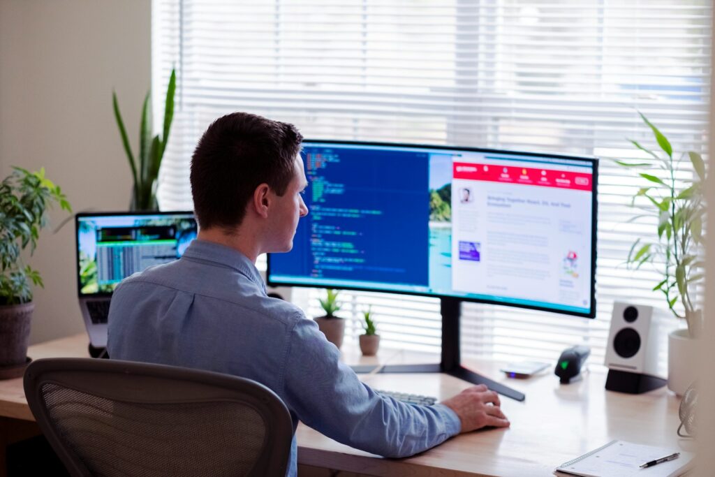 b6jinerwmz0 - The Importance of CRM Systems for Martial Arts Schools man in gray dress shirt sitting on chair in front of computer monitor