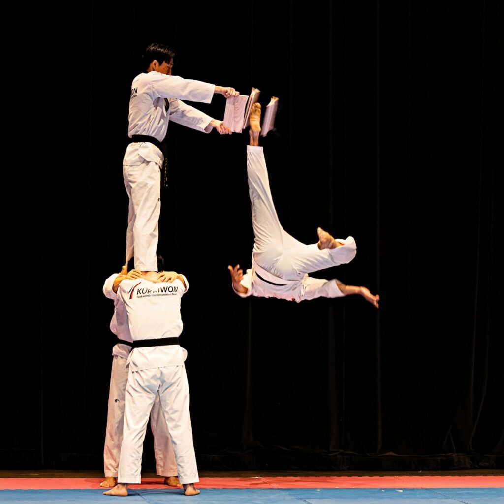 bbsfocpdbgk - Customer Experience a couple of men standing on top of each other on a stage