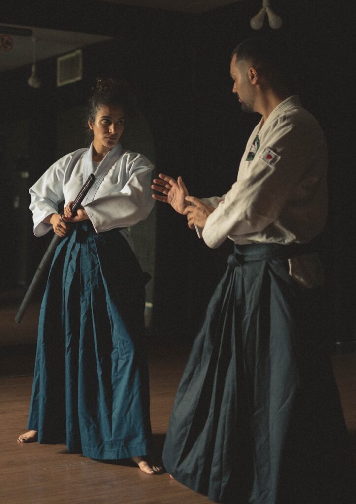 A man and a woman standing in a dark room