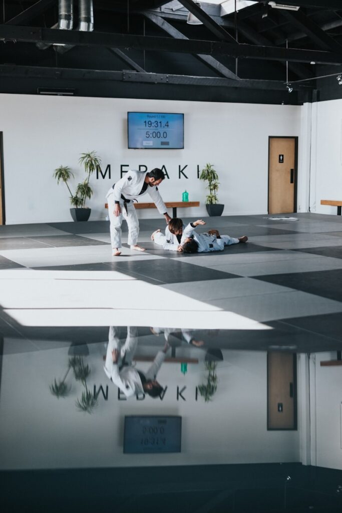 fiik8rznkqc - Lead Generation Strategies for Martial Arts Businesses man in white shirt and black pants sitting on white floor