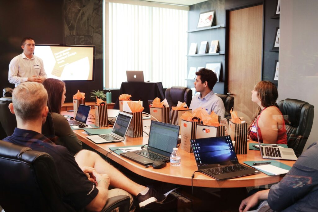 gmsnxqiljp4 - 4 Digital Marketing Trends Every Martial Arts School Owner Should Consider In 2015 man standing in front of people sitting beside table with laptop computers