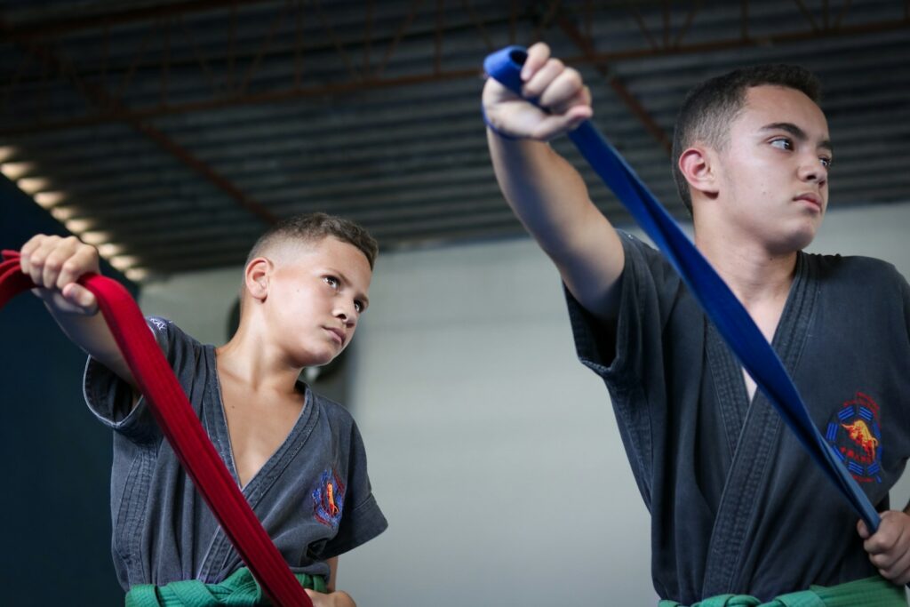 hrzdric1m5g - UKActive Summit 'Solving Inactivity' two boys posing while holding red and blue straps