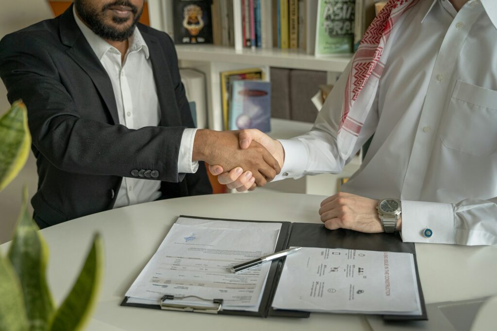 ma4aw8zozlm - Membership Management: How to Handle Cancellations and Freezes Effectively a couple of men shaking hands over a desk